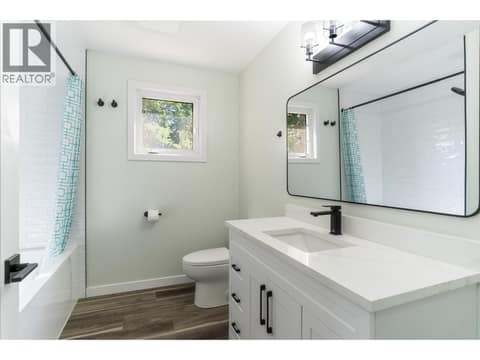 A beautiful newly renovated bathroom on the main floor at 2323 Vale Avenue, Lumby Valley