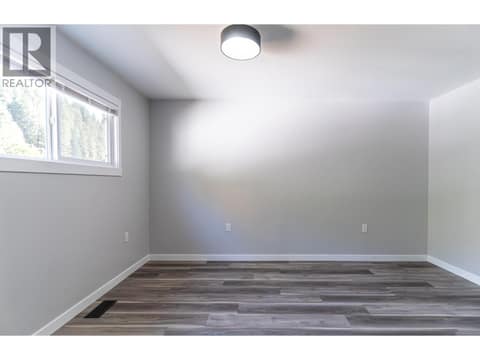 Second brighten open bedroom on the upper floor at 2323 Vale Avenue, Lumby Valley