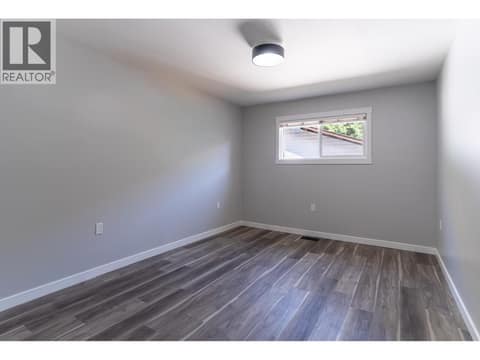 Second brighten open bedroom on the upper floor at 2323 Vale Avenue, Lumby Valley