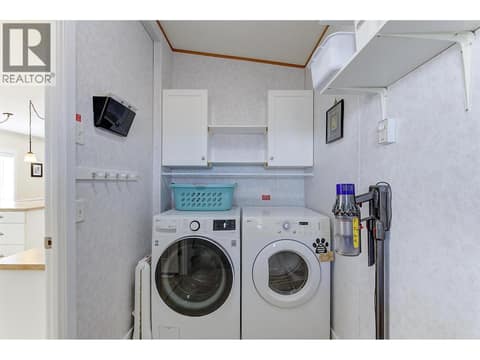 Laundry Room with Storage at 2440 Old Okanagan Highway Unit# 1304, Westbank Centre, West Kelowna