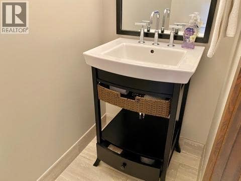 Half bath on main level. at 101 Dormie Drive Unit# 3E, Predator Ridge, Vernon