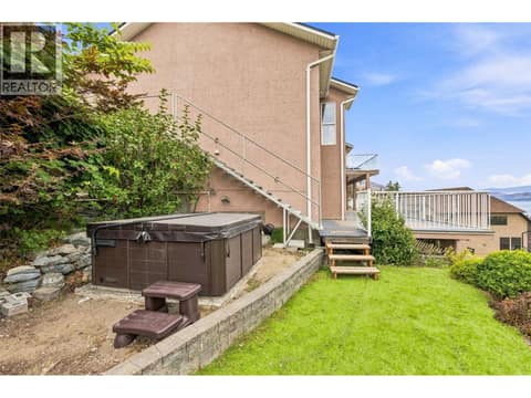 Backyard Space | Lower Level - With low-maintenance turf & hot tub at 1525 Bear Creek Road Unit# 14, West Kelowna Estates