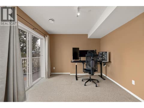 Bedroom #3 | Lower Level - with access to lower level deck (deck #2) at 1525 Bear Creek Road Unit# 14, West Kelowna Estates