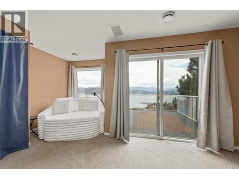 Bedroom #3 | Lower Level - with access to lower level deck (deck #2) at 1525 Bear Creek Road Unit# 14, West Kelowna Estates