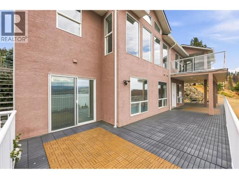 Deck #2 | Lower Level - Partially covered deck with outdoor access to upper level at 1525 Bear Creek Road Unit# 14, West Kelowna Estates