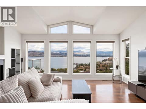 Living Room | Main Level - With updated flooring, gas fireplace & stunning lake views from both levels in the home! at 1525 Bear Creek Road Unit# 14, West Kelowna Estates
