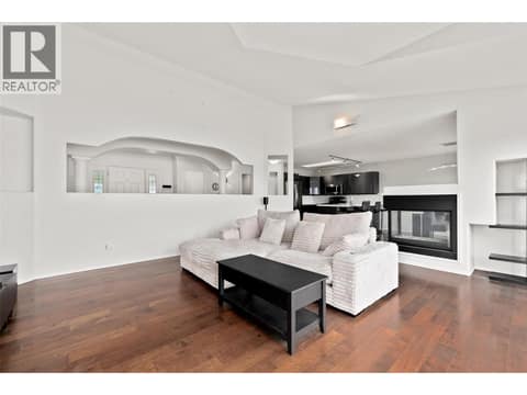 Living Room | Main Level - With incredible lake views, gas fire place, & updated flooring at 1525 Bear Creek Road Unit# 14, West Kelowna Estates