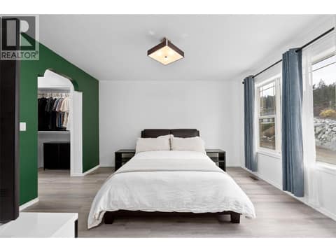 Primary Bedroom | Main Level - With 4 piece ensuite, walk-through closet & lake views at 1525 Bear Creek Road Unit# 14, West Kelowna Estates