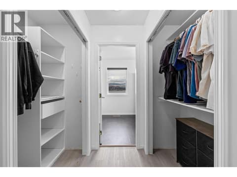 Primary Walk-through Closet | Main Level at 1525 Bear Creek Road Unit# 14, West Kelowna Estates