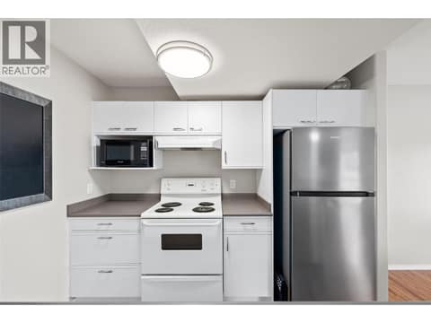 Suite Kitchen | Lower Level - With updated stainless steel appliances at 1525 Bear Creek Road Unit# 14, West Kelowna Estates
