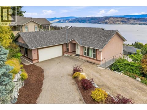 Updated 4 bed/ 4 bath suited rancher with stunning lake views from all levels, an attached double-car garage, low-maintenance backyard, hot tub & more! at 1525 Bear Creek Road Unit# 14, West Kelowna Estates
