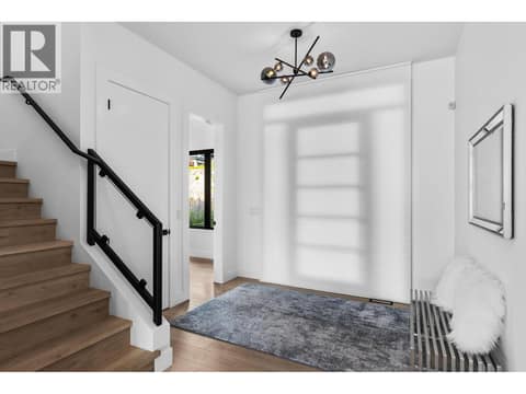 Front door has automated blind that fully covers glass door at 1539 Rocky Point Drive, Wilden, Kelowna
