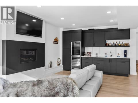 Full wet bar and beverage fridges at 1539 Rocky Point Drive, Wilden, Kelowna