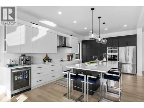 Induction cooktop and built-in oven/microwave at 1539 Rocky Point Drive, Wilden, Kelowna