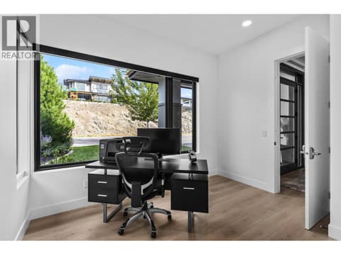 Main floor den/office, but also a bedroom at 1539 Rocky Point Drive, Wilden, Kelowna