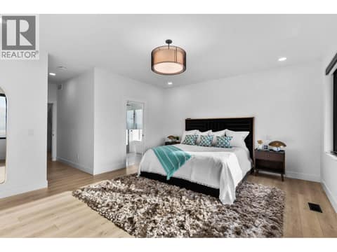Primary bedroom on upper floor at 1539 Rocky Point Drive, Wilden, Kelowna
