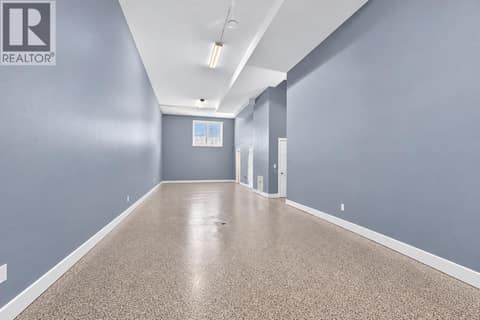 **AI edited to remove belongings** at 3359 Cougar Road Unit# 9, Westbank Centre, West Kelowna