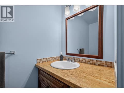 Half bath on the first level at 3359 Cougar Road Unit# 9, Westbank Centre, West Kelowna