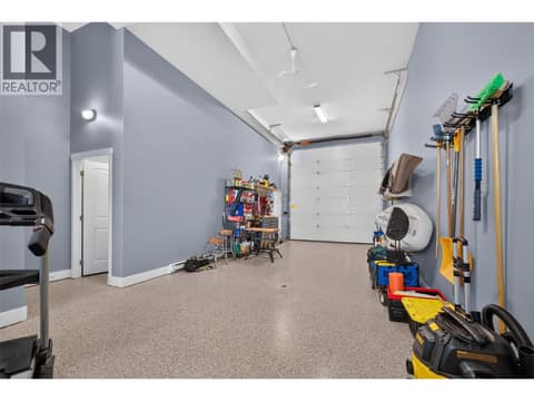 With oversized garage doors at 3359 Cougar Road Unit# 9, Westbank Centre, West Kelowna
