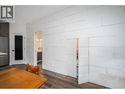 Custom millwork feature wall w/cleverly concealed under stair storage! at 805 Burne Avenue Unit# 4, Kelowna South