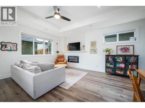 Living room with fireplace! at 805 Burne Avenue Unit# 4, Kelowna South