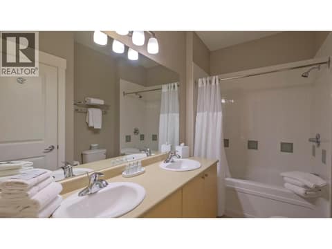 5pc Main Bathroom with cheater door to second bedroom at 4205 Gellatly Road Unit# 304, Westbank Centre, West Kelowna