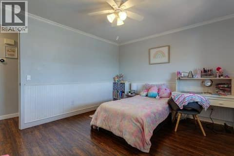 Bedroom on the upper floor. **This can be used for the primary bedroom at 2440 Old Okanagan Highway Unit# 1114, Westbank Centre, West Kelowna