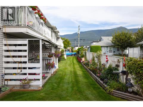 Back side of your building, your unit is top floor with excellent natural light at 2985 Smith Drive Unit# 207, Armstrong/ Spall.