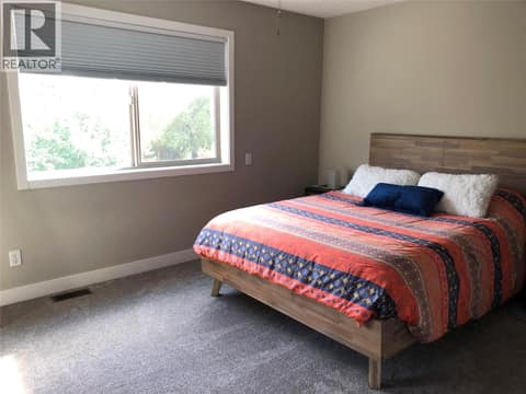 Primary bedroom, Photo supplied by owner. at 3600 Pleasant Valley Road Unit# 3, East Hill, Vernon