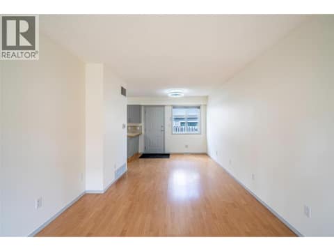 Living room and eating area with back door leading to deck at 4100 19 Street Unit# A & B Lot# 4, Harwood, Vernon