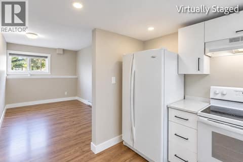 Kitchen looking into Living Room *Virtually Staged* at 465 - 467 Killarney Road, Rutland North, Kelowna