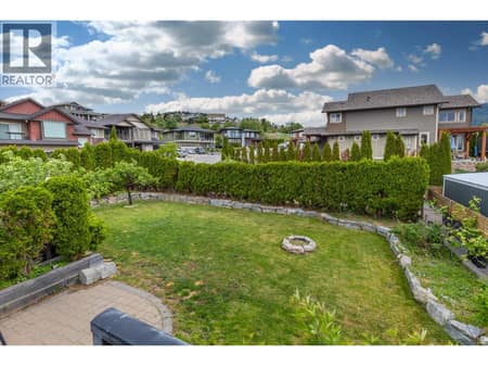 Fenced Back Yard from Deck at 6555 Blackcomb Place, Foothills, Vernon