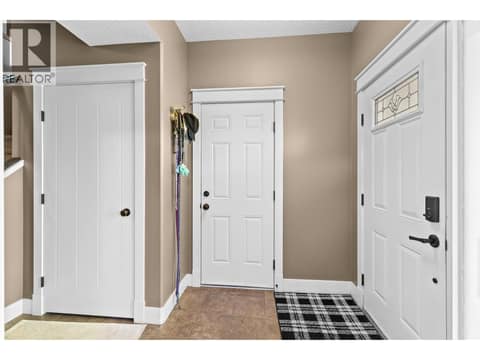 Front entry and garage entry at 6555 Blackcomb Place, Foothills, Vernon