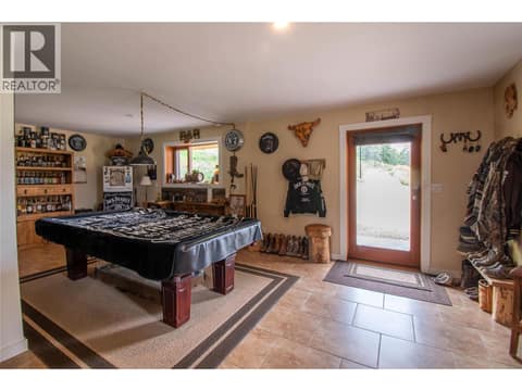 Basement Games Room area has door to Patio at 1225 Round Lake Road, Armstrong/ Spall.