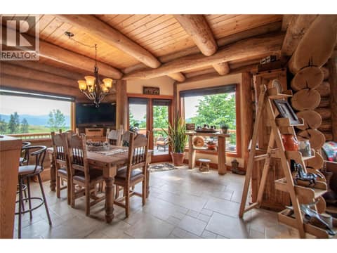 Dining Room leads to full-width wrap-around sundeck! at 1225 Round Lake Road, Armstrong/ Spall.
