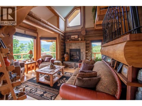 Great Room with Stone Fireplace at 1225 Round Lake Road, Armstrong/ Spall.