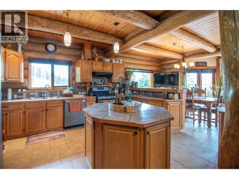 Island Kitchen with Tiled Countertops at 1225 Round Lake Road, Armstrong/ Spall.