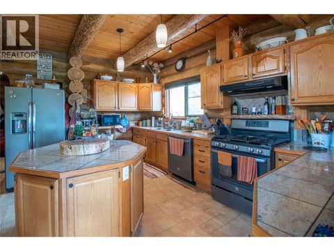 Kitchen - Sinks take in the views over the property! at 1225 Round Lake Road, Armstrong/ Spall.