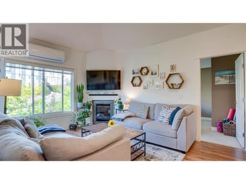 Living Room and entry to guest bedroom at 3211 Centennial Drive Unit# 28, Alexis Park, Vernon