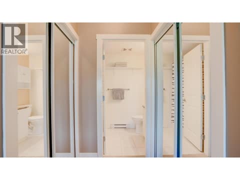 Walk through closets and entry to 4-piece ensuite at 3211 Centennial Drive Unit# 28, Alexis Park, Vernon