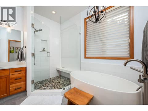 Soaker tub and tiled shower at 100 Kestrel Place Unit# 11, Adventure Bay, Vernon