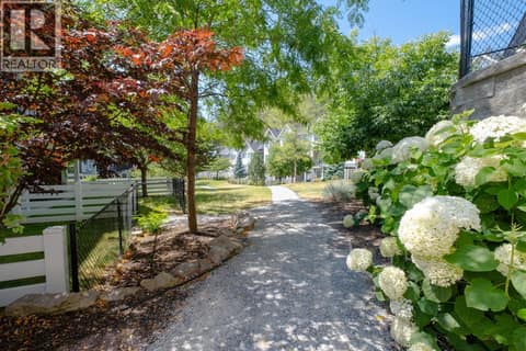 Beautiful landscaping throughout the strata with walking paths and access to the surrounding trails at 2490 Tuscany Drive Unit# 82, Shannon Lake, West Kelowna