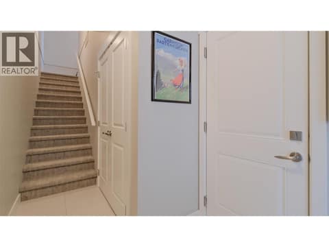 Foyer leading to stairs going to main floor-garage access to the right at 2490 Tuscany Drive Unit# 82, Shannon Lake, West Kelowna