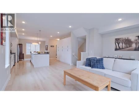 Main Living Room into Dining Room and Kitchen at 2490 Tuscany Drive Unit# 82, Shannon Lake, West Kelowna