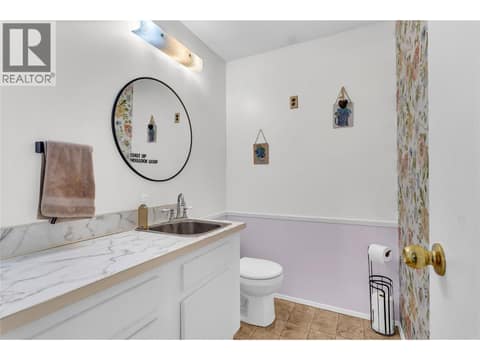 Half-bath in the lower level at 3227 McIver Road, Glenrosa, West Kelowna