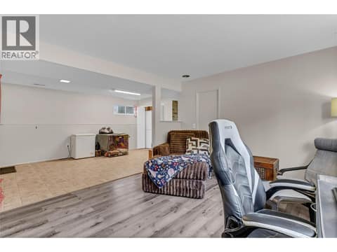 Lower level has a large open space (could be a play room) with storage, and separate entrance at 3227 McIver Road, Glenrosa, West Kelowna