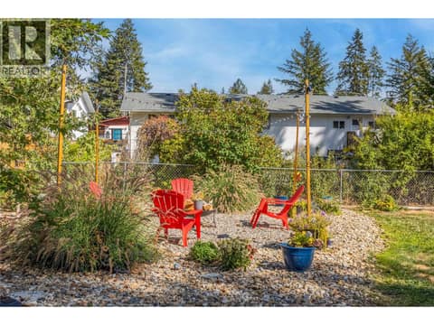 Sitting area in large backyard at 3227 McIver Road, Glenrosa, West Kelowna