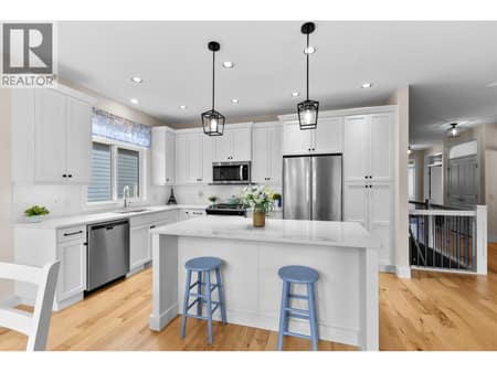 Kitchen with quartz counters and gas stove at 13155 Staccato Drive, Lake Country North West