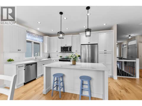 Kitchen with quartz counters and gas stove at 13155 Staccato Drive, Lake Country North West