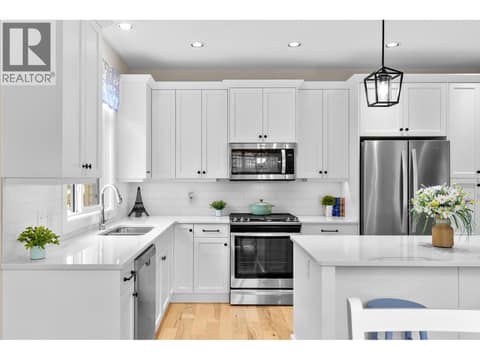 Kitchen with quartz counters and gas stove at 13155 Staccato Drive, Lake Country North West
